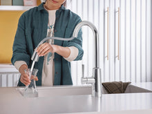 Load image into Gallery viewer, Moen Riley Chrome One-Handle Pulldown Kitchen Faucet Featuring Power Boost for a Faster Clean and Reflex Docking System for the Spray Head, Modern Kitchen Sink Faucet, 7402C