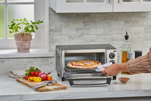 Load image into Gallery viewer, BLACK+DECKER 4-Slice Toaster Oven, Even Toast, 4 Cooking Functions Bake, Broil, Toast and Keep Warm, Removable Crumb Tray, Timer
