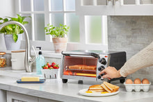 Load image into Gallery viewer, BLACK+DECKER 4-Slice Toaster Oven, Even Toast, 4 Cooking Functions Bake, Broil, Toast and Keep Warm, Removable Crumb Tray, Timer