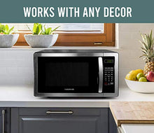 Load image into Gallery viewer, Farberware 1.1 Cu. Ft. Stainless Steel Countertop Microwave Oven with 6 Cooking Programs, LED Lighting, 1000 Watts