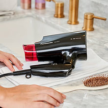 Load image into Gallery viewer, Panasonic nanoe Compact Hair Dryer for Healthy-Looking Hair, 1400W Portable Hair Dryer with Folding Handling and QuickDry Nozzle for Fast Drying – EH-NA27-K (Black/Pink)