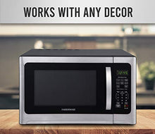 Load image into Gallery viewer, Farberware Countertop Microwave 1100 Watts, 1.2 cu ft - Smart Sensor Microwave Oven With LED Lighting and Child Lock - Perfect for Apartments and Dorms - Easy Clean Black Interior, Stainless Steel