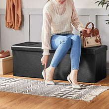 Load image into Gallery viewer, SONGMICS 43 Inches Folding Storage Ottoman Bench, Storage Chest, Footrest, Coffee Table, Padded Seat, Faux Leather, Holds up to 660 lb, Black ULSF701