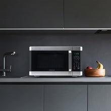 Load image into Gallery viewer, Farberware Countertop Microwave 1100 Watts, 1.6 cu ft - Smart Sensor Microwave Oven With LED Lighting and Child Lock - Perfect for Apartments and Dorms - Easy Clean - Stainless Steel
