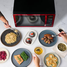 Load image into Gallery viewer, Farberware Countertop Microwave 1000 Watts, 1.1 cu ft - Microwave Oven With LED Lighting and Child Lock - Perfect for Apartments and Dorms - Easy Clean Metallic Red
