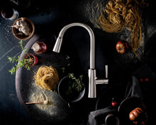 Load image into Gallery viewer, Moen Riley Spot Resist Stainless One-Handle Pulldown Kitchen Faucet Featuring Power Boost and Reflex Docking System for the Spray Head, Modern Kitchen Sink Faucet, 7402SRS
