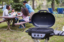 Load image into Gallery viewer, Coleman Roadtrip 225: Portable Propane Grill, Gas Grill with Push-Button Start, Foldable Legs &amp; Wheels, Side Table, and 11k BTUs
